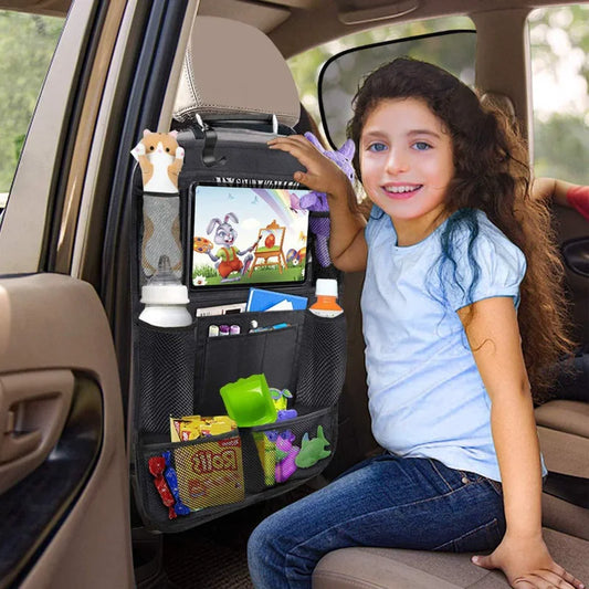 Child watching a tablet held in the organizer's touchscreen sleeve