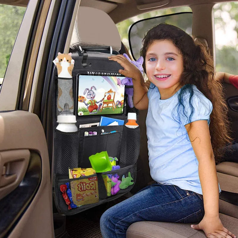 Child watching a tablet held in the organizer's touchscreen sleeve