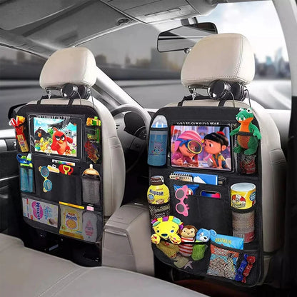 Two back seat organizers on the front seats, filled with tablets, snacks and toys